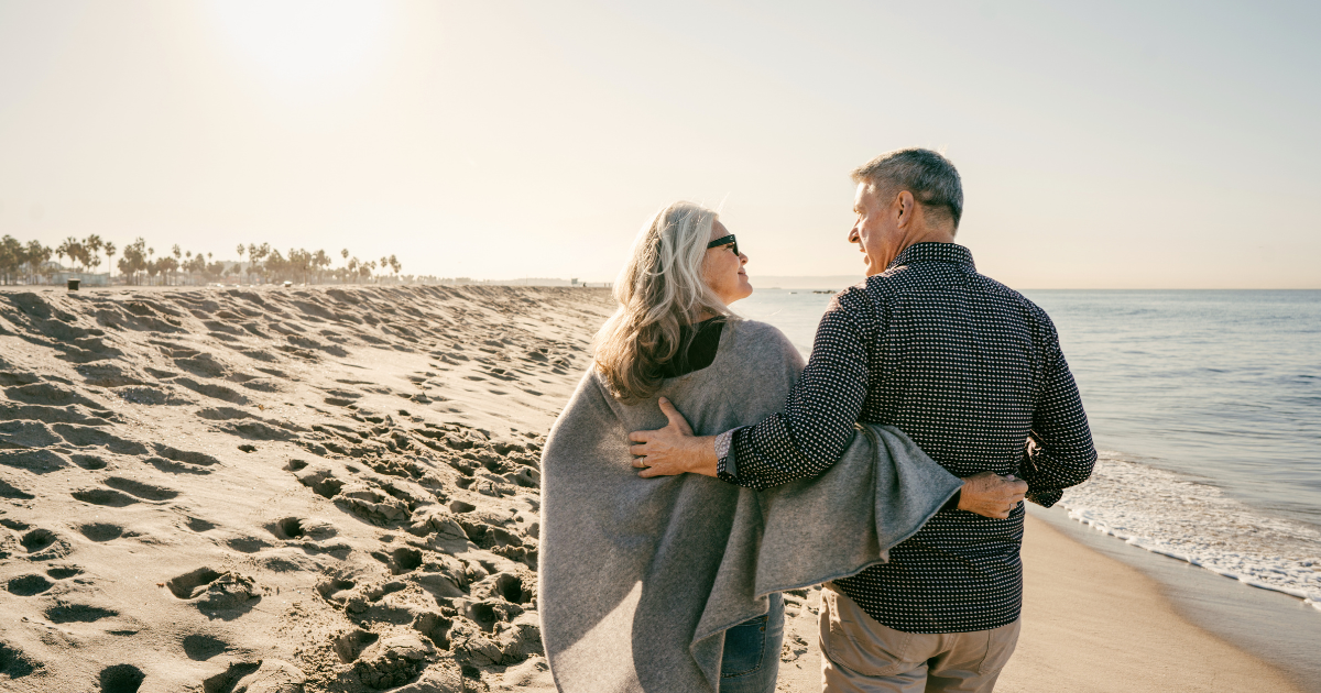 North County San Diego homeowners walking on the beach while thinking about downsizing